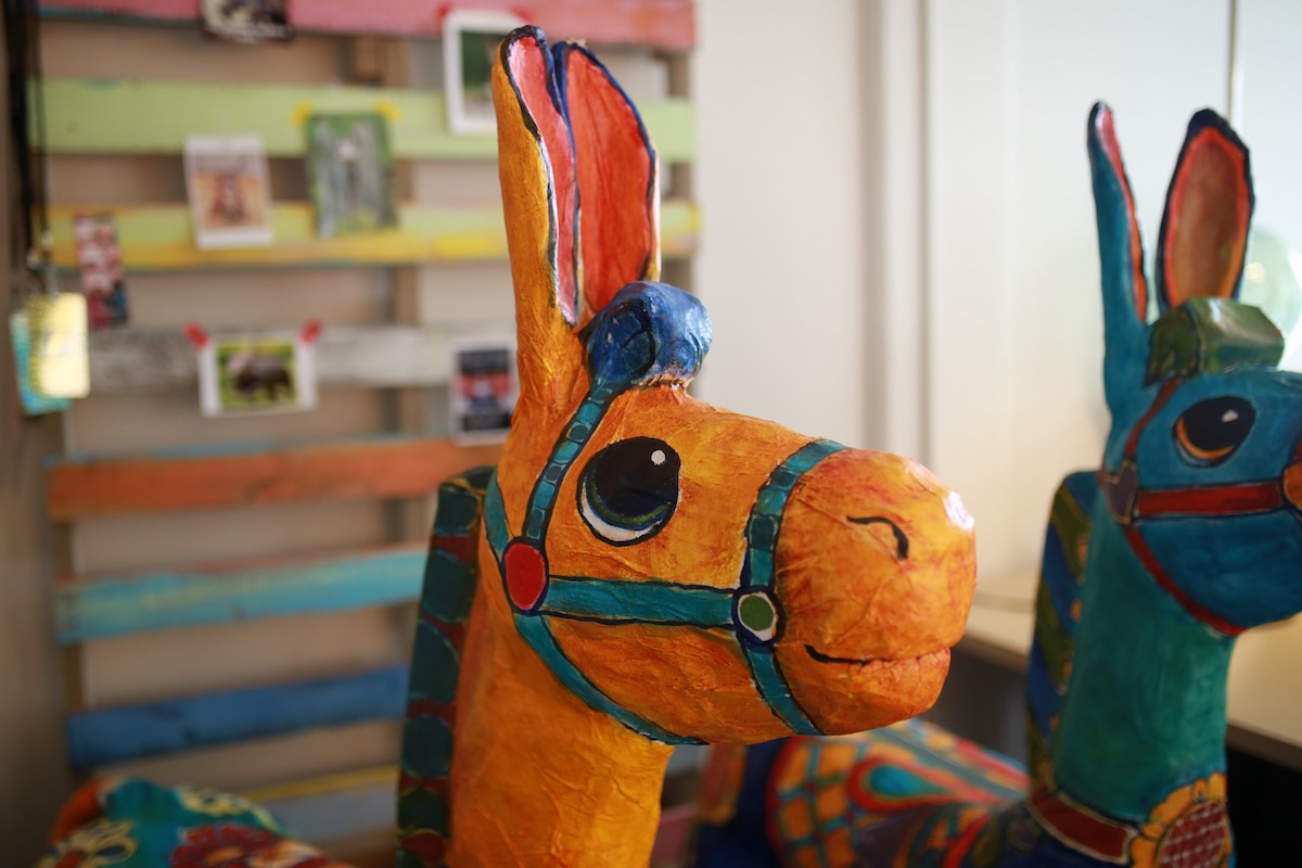 A pair of handmade, paper-mache burros made by artist Gabrielle Carey at Heartfelt Play Studio in Costa Mesa.