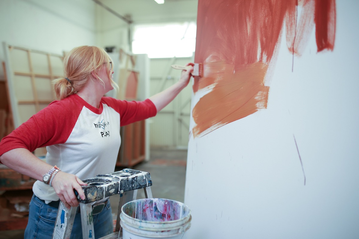 On Canvas: Gabrielle Carey paints a large canvas her studio in Costa Mesa, California