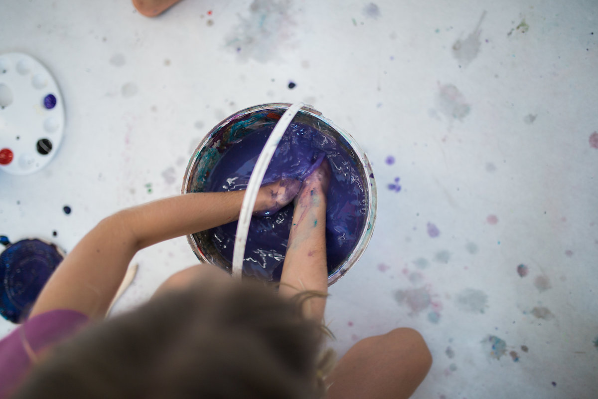 Hands in Purple Paint at HeARTfelt Play Studio in Costa Mesa, California