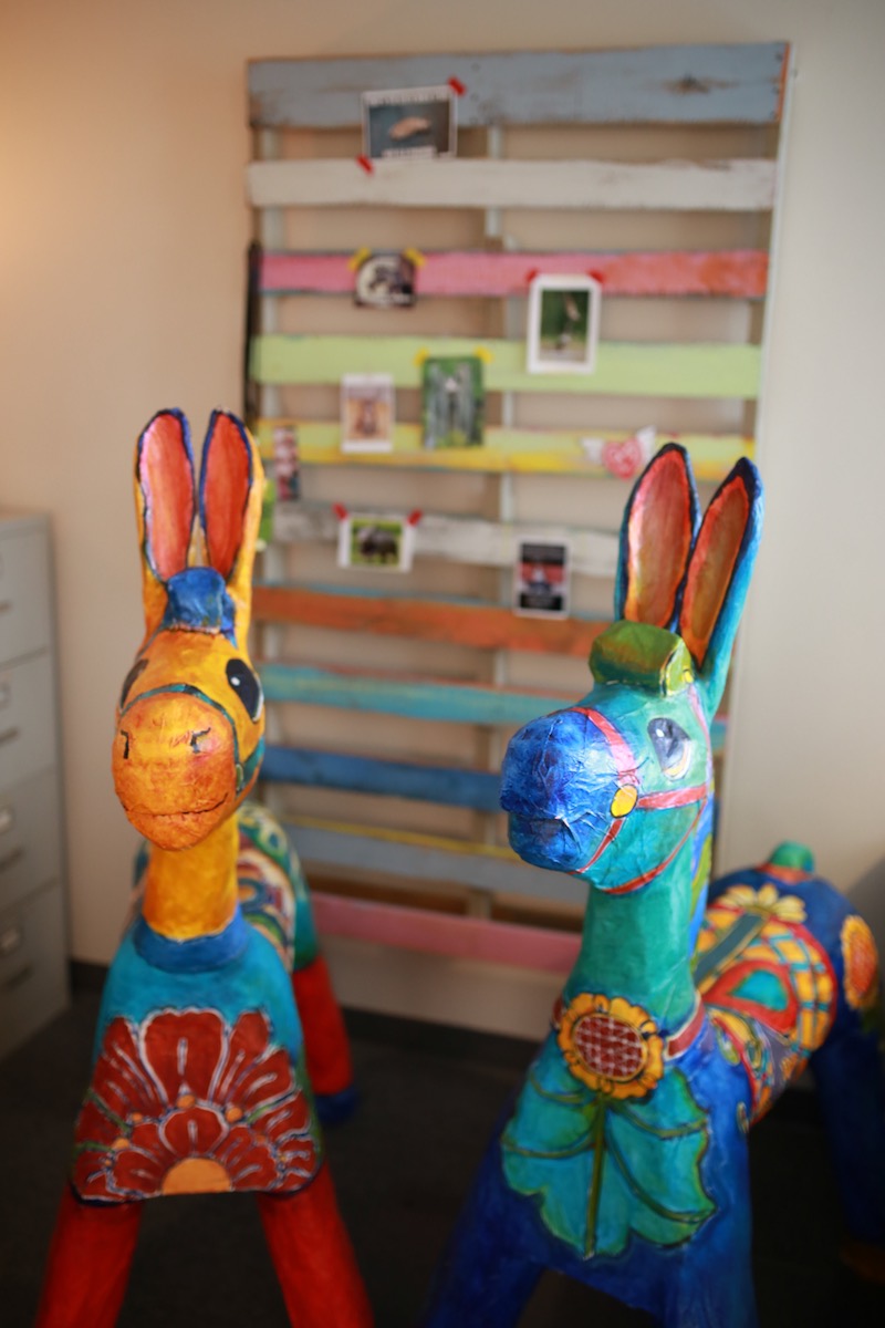 A pair of handmade, paper-mache burros made by artist Gabrielle Carey at Heartfelt Play Studio in Costa Mesa.